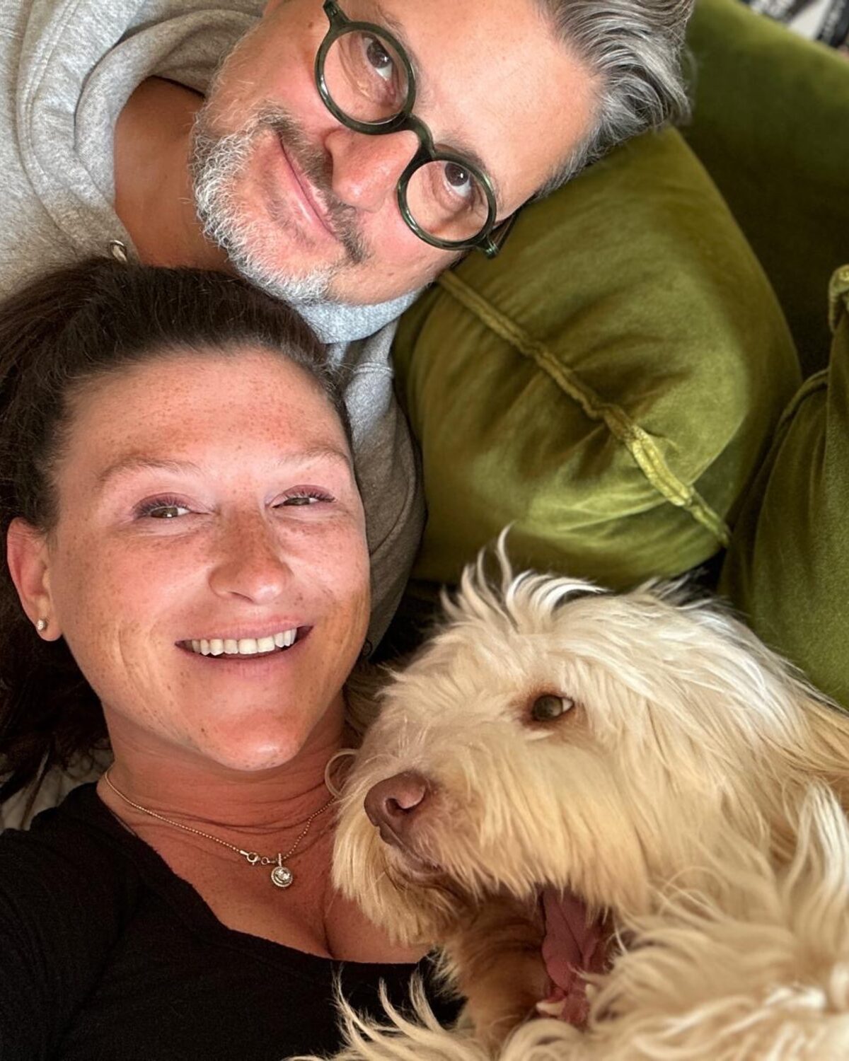 Ben and Morgan at home on the sofa with Stanley Pucci, their Tibetan Terrier