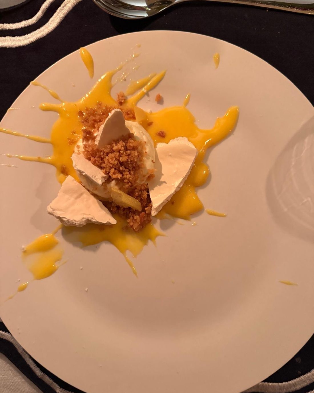 Broken meringue with soft cream, a citrus curd and toasted crumb, finished with a bright lemon sauce