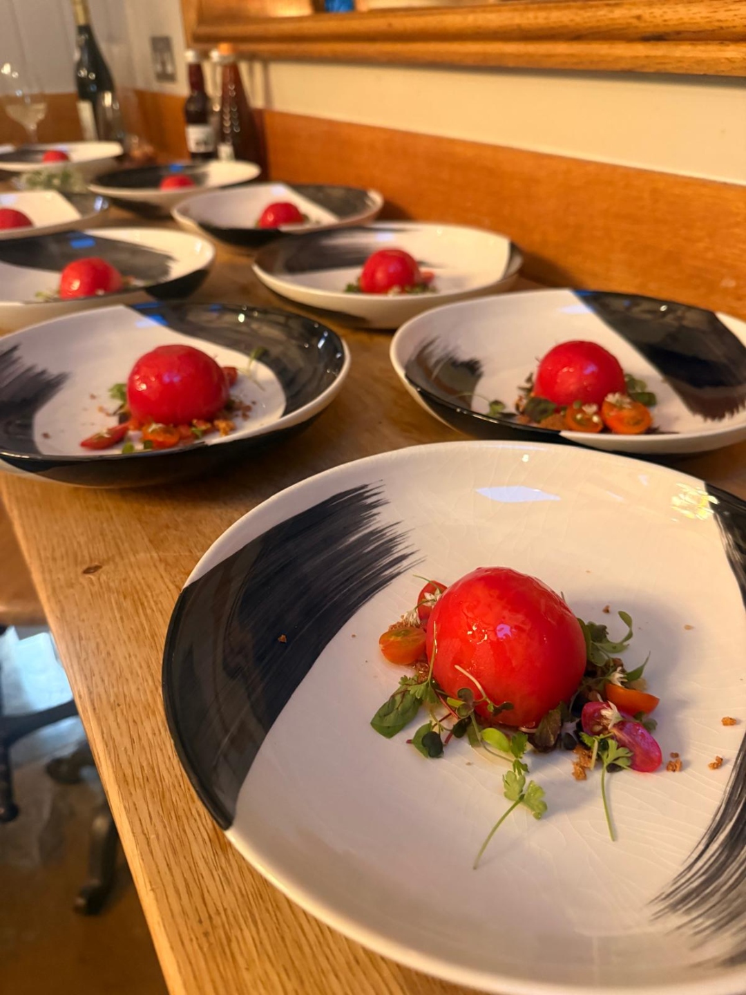 Tomato tartare courses lined up in the kitchen, ready to be served
